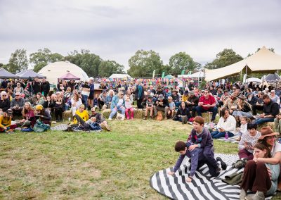 off grid living festival - people sitting on the grass